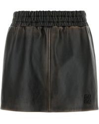 Miu Miu - Minigonna in nappa testa di moro - Lyst