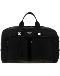 Prada - Borsa da viaggio in tela nera - Lyst