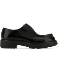 Prada - Scarpe stringate Diapason in pelle nera - Lyst