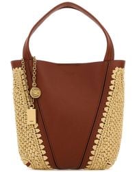 Chloé - Borsa a secchiello Chloé Spin piccola bicolor in pelle e rafia - Lyst