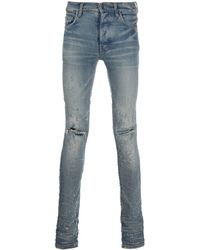 Amiri Jeans skinny strappati con finitura distressed - Blu