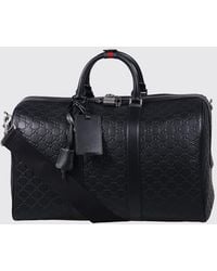 Gucci - Gg Emblem Leather Duffle Bag With Embossed Gg Monogram - Lyst