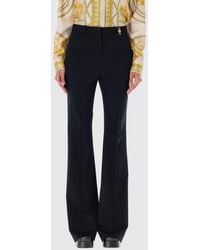 Versace - Flared Stretch Virgin Wool Trousers With Metal Hardware - Lyst