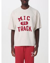 Champion - Relaxed Fit Cotton T-Shirt With Front Logo And Slogan Print - Lyst