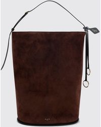 Alaïa - Hip Suede Sheepskin Bucket Bag With Logo Charm - Lyst