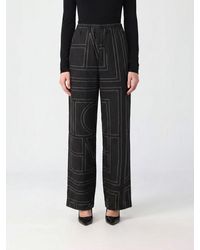 TOTEME - High-Waisted Silk Palazzo Trousers With Logo Print - Lyst