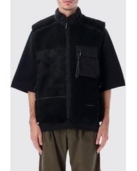 and wander - Technical Wool-Blend Gilet With High Neck And Zip Pockets - Lyst