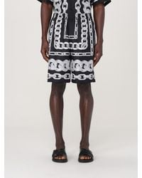 Versace - Pantalones cortos de bermudas de seda estampados de - Lyst