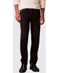 Calvin Klein - Tapered Fit Mid-Rise Cotton Denim Jeans - Lyst