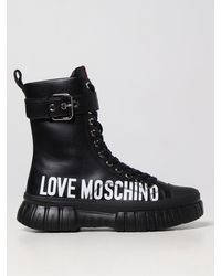 Mujer Zapatos de Botas de Botas de caña alta Botas Love Moschino de Caucho de color Negro 