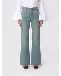 McQueen - Flared Cotton Denim Jeans - Lyst