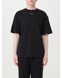 Calvin Klein - T-shirt basic con mini logo - Lyst