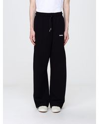 DISCLAIMER - Wide-Leg Cotton Jogging Trousers With Elasticated Waist - Lyst