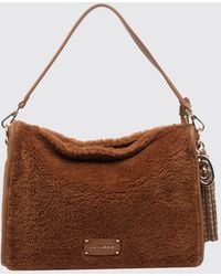 La Carrie - Faux Fur Shoulder Bag With Removable Handle, Strap And Tassels - Lyst