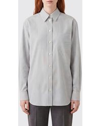 The Row - Striped Cotton Shirt With Classic Collar And Asymmetric Hem - Lyst