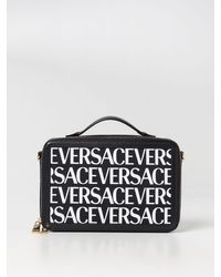 Versace - Borsa in canvas e pelle con logo all over - Lyst