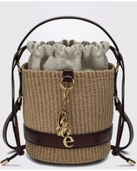 Chloé - Chlo&Eacute Raffia And Calfskin Leather Mini Bucket Bag With Metallic Logo - Lyst