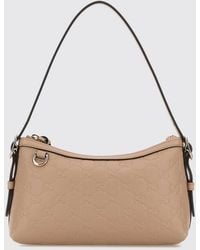 Gucci - Leather Bag With Embossed Gg Monogram - Lyst