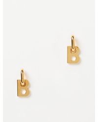 Bottle cap drop earrings balenciaga best sale