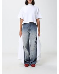 Alaïa - AlaiA Short-Sleeved Cotton Jersey Top With Mock Neck And Asymmetric Hem - Lyst