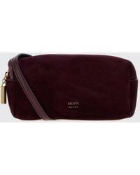 KHAITE - Kye Suede Mini Crossbody Bag With Laminated Logo - Lyst