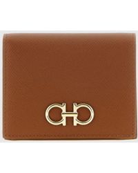 Ferragamo - Gancini Grained Calfskin Leather Bifold Wallet With Metal Logo - Lyst