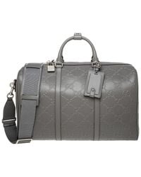 Gucci - GG Embossed Canvas & Leather Duffel Bag - Lyst