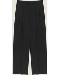 Givenchy - Double Pleat Trousers - Lyst