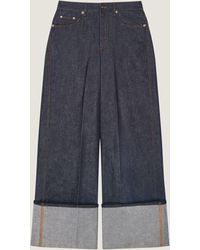 Givenchy - Raw Turn-Up Jeans - Lyst