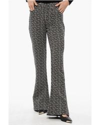 Balmain - Low-Rise Wool Flared Trousers - Lyst