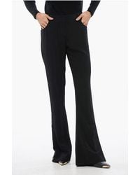 Balmain - Flared-Fit Trousers With Side Rhinestone Stripe - Lyst