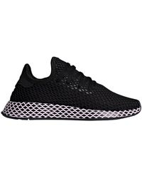 adidas originals deerupt sneakers in white and lilac
