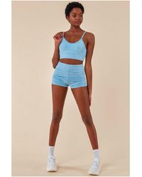 Cosmochic - Cropped Bralette & Cycle Short Set - Lyst