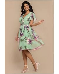 Goddiva - Sustainable Floral Print Midi Wrap Dress With Flutter Sleeves - Lyst