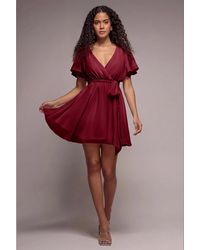 Goddiva - Flutter Sleeve Wrap Mini Dress With Elasticated Waist - Lyst