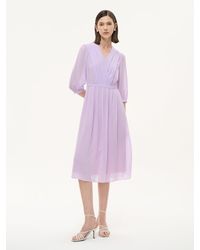 GOELIA - V-Neck Back Tie Pleated Midi Dress - Lyst