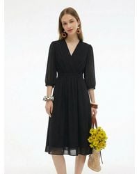 GOELIA - V-Neck Pleated Lace Up Wrap Midi Dress - Lyst