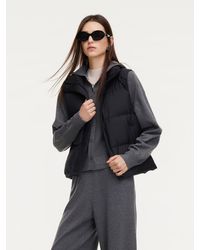 GOELIA - Stand Collar Zip-Up Goose Down Vest - Lyst