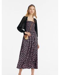 GOELIA - Bowknot Printed Spaghetti Strap Maxi Dress And Knitted Cardigan Two-Piece Set With Scrunchie - Lyst