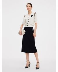 GOELIA - V-Neck Cut-Out Knitted Top And Half Skirt Two-Piece Set - Lyst