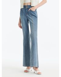 GOELIA - Back-Slit Denim Flared Jeans - Lyst