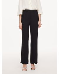 GOELIA - Four-Way Stretch Front Slit Micro-Flared Pants - Lyst