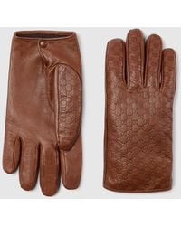 Gucci - Embossed Gg Leather Gloves - Lyst