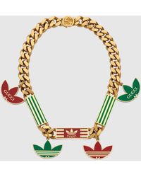 Gucci 【公式】 (グッチ)adidas X トレフォイル ペンダント付き ゴル ...