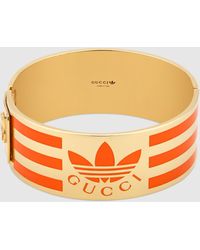 Gucci 【公式】 (グッチ)adidas X トレフォイル ペンダント付き ゴル ...