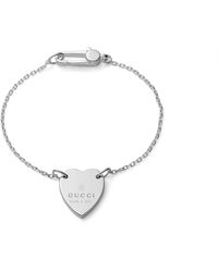 Gucci Armband mit Herz Anhänger und Markenzeichen - Schwarz
