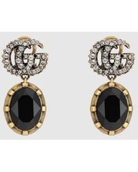 Gucci - Ohrringe mit Doppel G und schwarzen Kristallen - Lyst