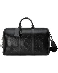 Gucci Reisetasche aus geprägtem GG Leder - Schwarz