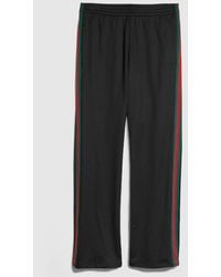 Gucci - Shiny Technical Jersey Sportswear Pants - Lyst