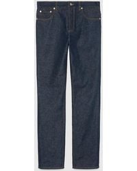 Gucci - Denim Trousers With GG Embossed Detail - Lyst